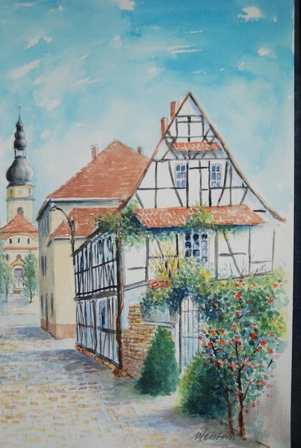 Im Vordergrund das Älteste Haus in Böhl-Iggelheim.