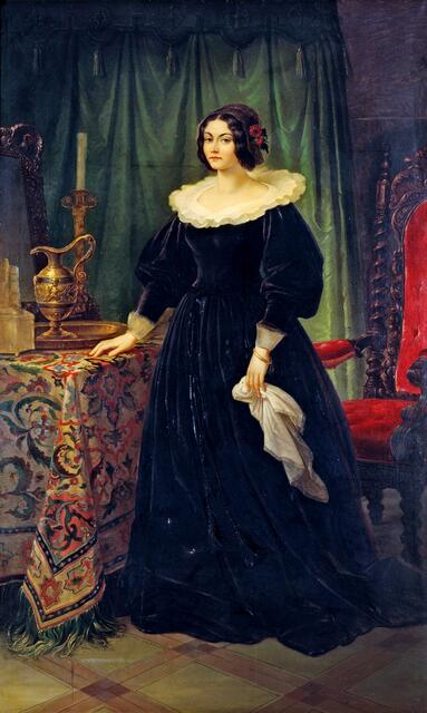Lola Montez, Gemälde von Wilhelm von Kaulbach, 1847, Öl auf Leinwand
Auf dem lebensgroßen Ganzfigurenporträt ist Lola Montez, die Geliebte Ludwigs I., selbstbewusst in einem historischen Kostüm dargestellt. Sie ist in ein schwarzes Samtkleid mit weißem Tellerkragen gekleidet, das nicht zeitgenössisch ist. Der Auftraggeber des Gemäldes war Ludwig I., der seine Geliebte von Kaulbach in dessen Münchner Atelier malen ließ. | Foto: Münchner Stadtmuseum, Sammlung Graphik / Gemälde