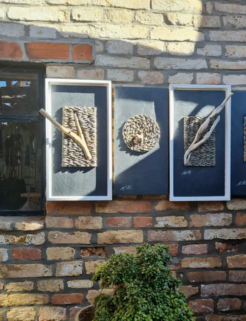 "Rheinwerk" 
Kunsthandwerk aus Kieselsteinen eingebettet in schwarze Schieferplatten | Foto: Heinrich Welch 