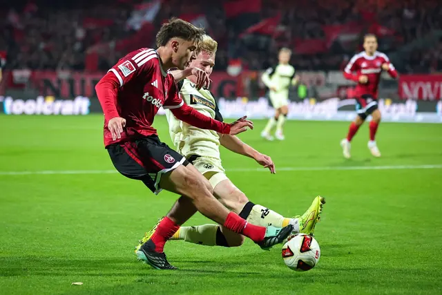 Nürnbergs Fernandez (vorne) im Zweikampf mit Kaiserslautern-Profi Haas | Foto: Daniel Karmann/dpa